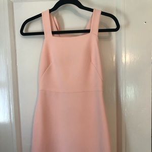 Peach colored mini dress with bow sleeve